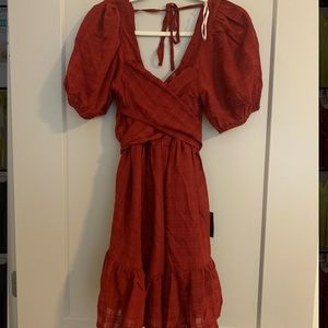 Short puffy sleeve red dress with open back. Size M.